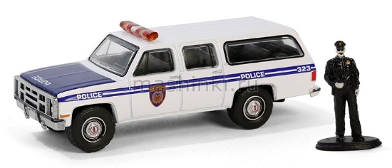 Изображение GREENLIGHT 1/64 GMC Suburban 2500 New York City Transit Police Department с фигуркой 1985